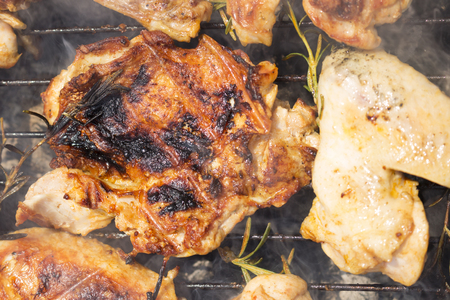 Grilled Deboned Chicken Meat On Smoking Barbecue With Rosemaryの写真素材