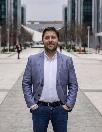 Businessman Outdoors in front of Office Building Standing Proud and Happy. Corporate Business...