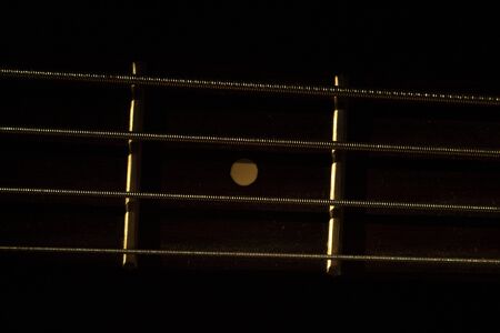 Bass guitar in music studio shot at golden hour