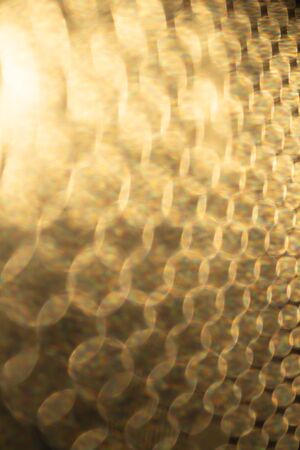 Abstract ,golden, blured texture background with bokeh effectの写真素材
