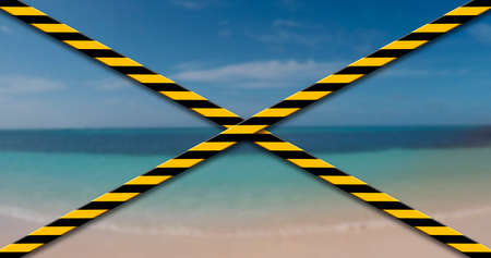 Beach closed due to Coronavirus, Covid19. Caution tape, restricted areaの写真素材