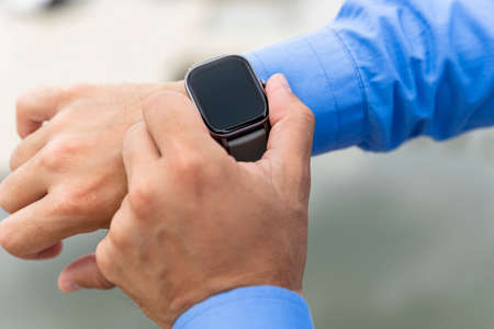 Smart watch on the man's hand. Technology and electronics