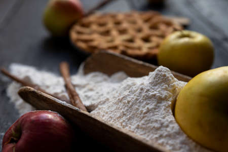 Homemade lattice Apple pie with cinnamon on an old textured wooden backgroundの写真素材