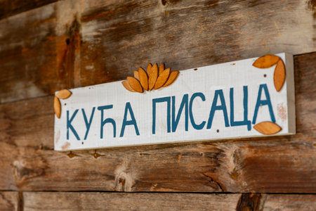 Drvengrad, Serbia- 18 September 2020: Sign with text "HOUSE OF WRITERS" at traditional wooden village Drvengrad built by Emir Kusturica. Mokra Gora in Zlatibor surroundingsのeditorial素材
