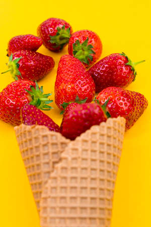 Ice cream cone with strawberries. Strawberry icecream. Healthy summer food conceptの写真素材