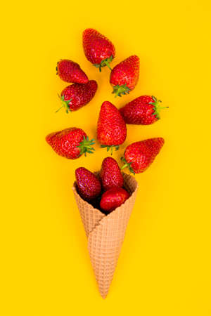 Ice cream cone with strawberries. Strawberry icecream. Healthy summer food conceptの写真素材