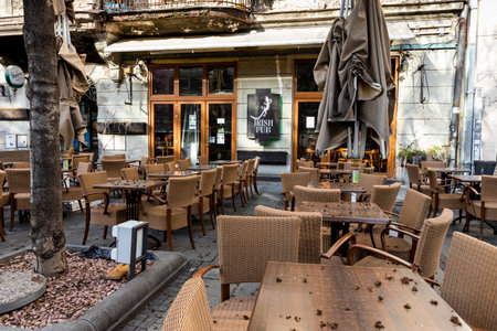 Belgrade, Serbia - March 23, 2021: Empty tables and chairs. Closed Irish pub in Belgrade due to coronavirus quarantine, COVID-19のeditorial素材