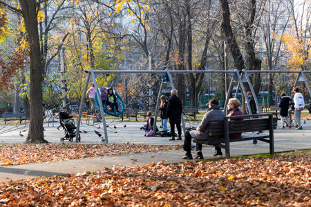 BELGRADE, Serbia - November 15, 2021 - Children playing at the playground in the park called Tasmajdan park in Belgrade, Serbia.のeditorial素材