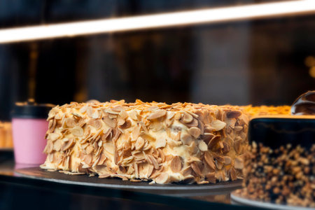 Different types of cakes in pastry shop glass display