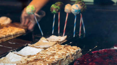 Different types of cakes in pastry shop glass displayの写真素材