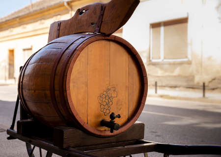 Wine barrel mad from wood in front of the wine celler outdoorsの写真素材