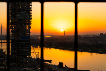BELGRADE, Serbia - February 22, 2021 - Belgrade Waterfront, modern business and residential area, buildings and construction site at beautiful sunset by the rive in Belgrade, Serbiaのeditorial素材