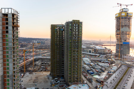 BELGRADE, Serbia - February 22, 2021 - Belgrade Waterfront, modern business and residential area, buildings and construction site at beautiful sunset by the rive in Belgrade, Serbiaのeditorial素材