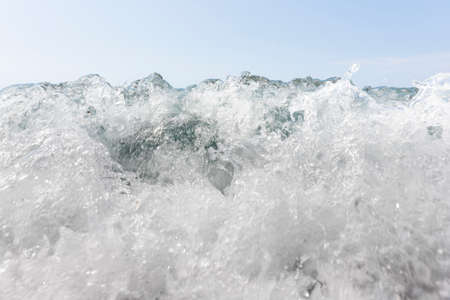 Wave splash at sea. Closeup of a splashing water