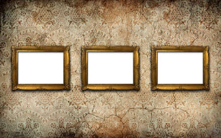 Golden vintage picture frame set with blank space on an old wall. Copy space, add photo or text
