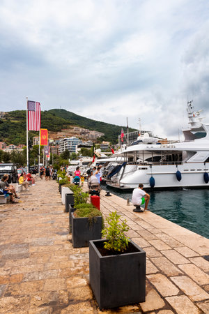 Budva, Montenegro - August 26, 2021: Luxury yacht anchored at harbour in the town of Budva, Montenegro. Luxury travel destination with beatuiful beaches at Adriatic seaのeditorial素材