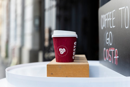 Belgrade, Serbia - November 15, 2021: Costa Coffee cups on the table. Takeaway, coffee to go. Costa Coffee is large British multinational coffeehouse companyのeditorial素材