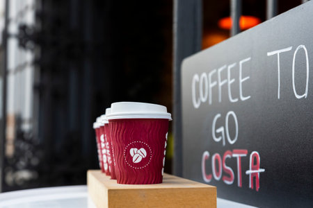 Belgrade, Serbia - November 15, 2021: Costa Coffee cups on the table. Takeaway, coffee to go. Costa Coffee is large British multinational coffeehouse companyのeditorial素材
