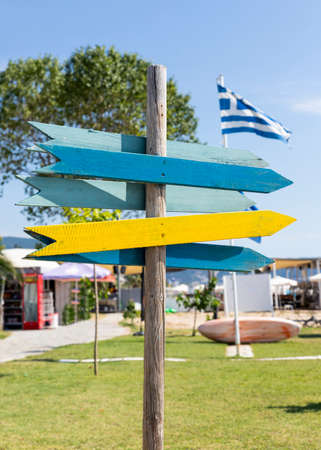 Wooden arrow sign post. Empty boards for your text. Copy space, add textの写真素材