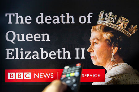 Belgrade, Serbia - September 12, 2022: The death of Queen Elizabeth II. Watching BBC news on tv...