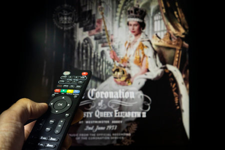 Belgrade, Serbia - September 12, 2022: Queen Elizabeth II coronation. Watching documentary about...