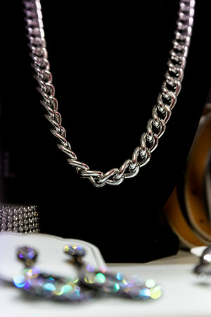 Female silver chain necklace on a displayの写真素材