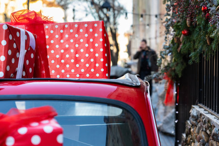Christmas presents and gift boxes on the roof top of a carの写真素材
