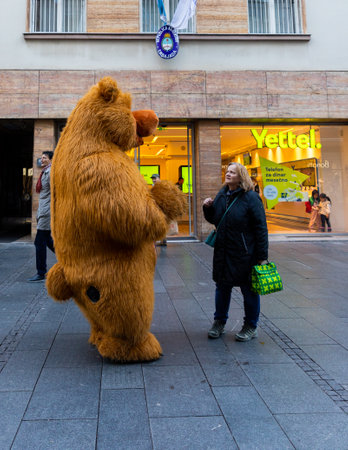 Belgrade, Serbia - December 23, 2022: Man in a bear costume walking the street of Knez Mihailova during the Christmas holidays in Belgrade, Serbiaのeditorial素材