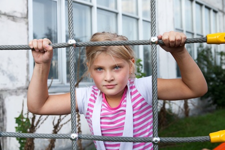 Young girl model on children playgroundの写真素材