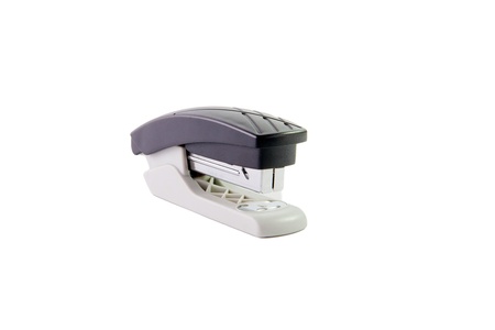 Black and metal office stapler over a white backgroundの写真素材