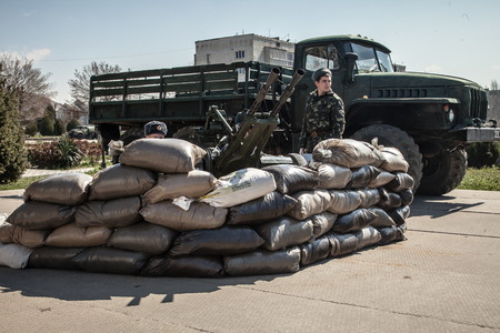 BELBEK, UKRAINE - March 21, 2014 Soldiers on the last day of the Ukrainian military base A4515 before being overtaken by Russian occupantsのeditorial素材