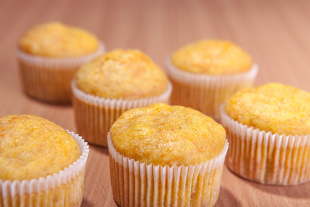 Three dessert cupcakes muffins on the tableの写真素材