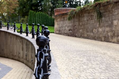 Vintage image of old cobblestone road with roadside pillarsの写真素材
