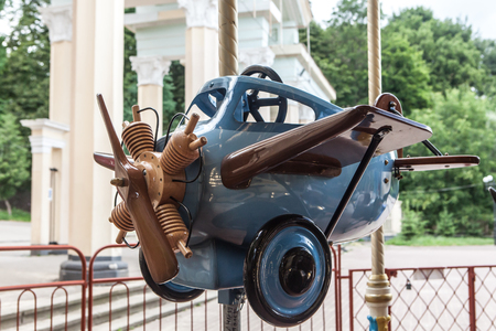 Fair amusement carousel merry-go-round figure closeup airplaneの写真素材