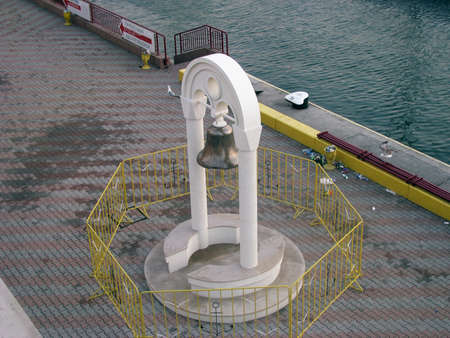 Sea pier and belfry after night shiftの写真素材