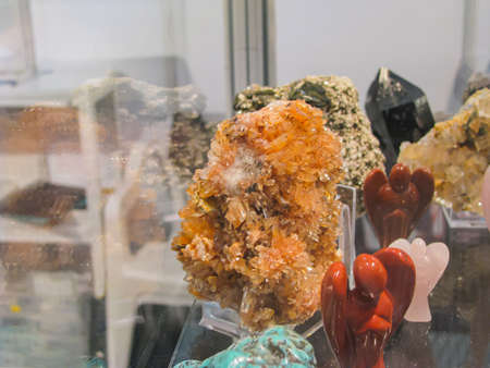 A Conglomerate of Citrine Quartz Crystals Among a Collection of Minerals and Natural Stone Craftsの写真素材