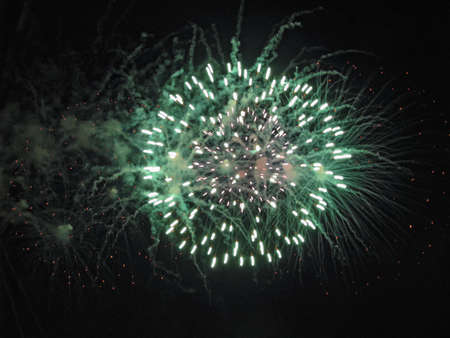 Fireworks, A Spectacular Explosion of Green and White Lights Against a Dark Sky, It Is Possible to...