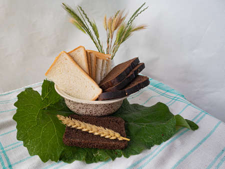 Sliced Bread in A Vase, Wheat Ear and Spikelets of Cereals in The Background