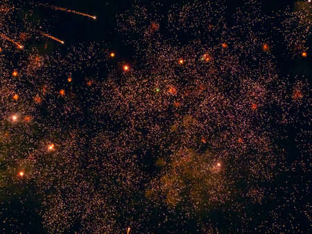 Bright Splashes of Festive Fireworks Lights Illuminated the Black Night Skyの写真素材