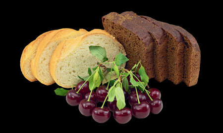 Still Life Photo of Cherry Fruits, Slices of Wheat and Rye Bread. Isolated On Black Backgroundの写真素材