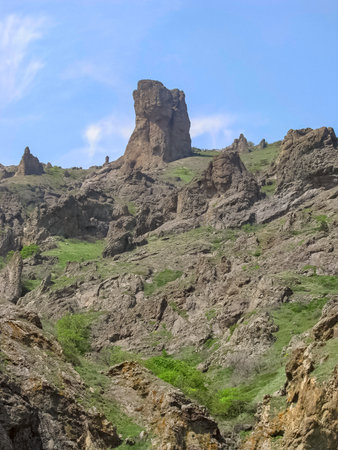 Among The High Rocks Standing Alone and Scattered Over the Mountain Range, One Stands Out, Located in The Foregroundの写真素材