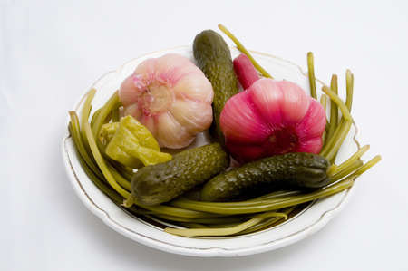 Marinated vegetables on a plate over light backgroundの写真素材