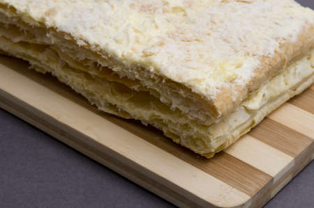 home made napoleon pastry on a boardの写真素材