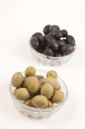Black and green olives in a cristal bowlesの写真素材