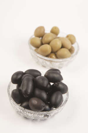 Black and green olives in a cristal bowlesの写真素材