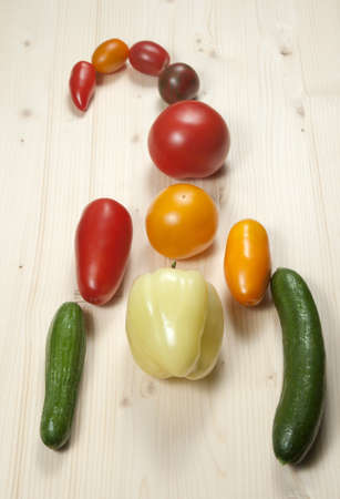 Scorpio from different cultivars of tomatos with paprika and cucumbersの写真素材