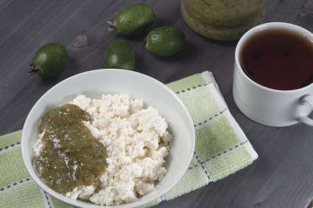 Curd with feijoa (pineapple guava) jam for breakfastの写真素材