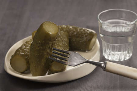 Salted cucumbers - traditional russian appetizer for vodkaの写真素材