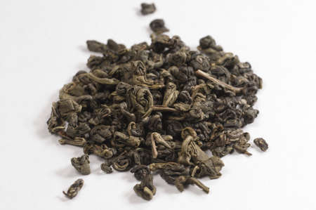Green tea over light background, macro shot