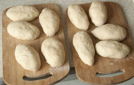 Pies on a board ready for frying